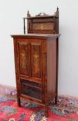 An Edwardian rosewood music cabinet,