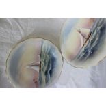 A pair of Royal Worcester porcelain plates of circular waved form,