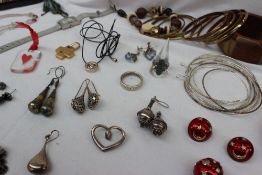 A quantity of costume jewellery including hoop earrings, bangles, other earrings, bracelets,