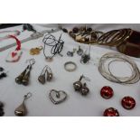 A quantity of costume jewellery including hoop earrings, bangles, other earrings, bracelets,