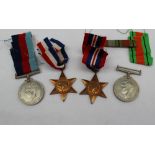 Four World War II medals, including the 1939-1945 Star, The France and Germany Star,