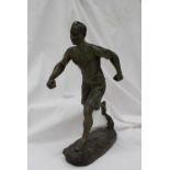 H Fogene A figure of a runner, on a rectangular base Spelter Signed 39.