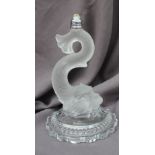 A Baccarat crystal glass lamp base in the form of a stylised dolphin, on a circular lobed base, 27.