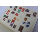 A simplex medium stamp album containing World Stamps,