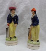 A pair of Staffordshire style figures of cricketers,