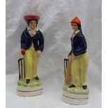 A pair of Staffordshire style figures of cricketers,