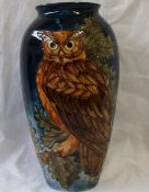 A Moorcroft pottery vase decorated with an eagle owl,