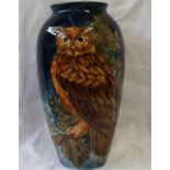 A Moorcroft pottery vase decorated with an eagle owl,