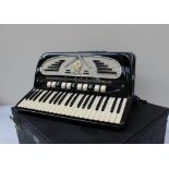 A Galanti Piano accordion, with black lacquer finish, cased,