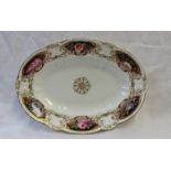 A Swansea porcelain dish of oval form painted with flowers to the border with a raised moulded rim,