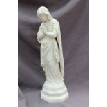 A Belleek porcelain figure modelled as the blessed Virgin Mary, Mother of God,