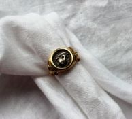 A 14ct yellow gold ring set with a Roman coin,
