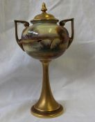 A Royal Worcester porcelain two-handled pedestal vase and cover of urn form, shape No.