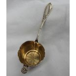 A continental white metal sifting spoon,