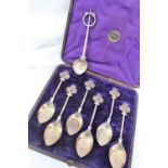 A set of six Victorian silver gilt spoons with a pierced trefoil top,