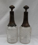 A pair of 19th century French silver and cut glass decanters, makers mark for Paul Frey,