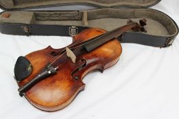 A German violin with a one piece back, ebonised stringing, bears a label "Francisco Ruggeri",