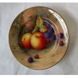 A Royal Worcester porcelain side plate painted with apples and blackberries to a naturalistic