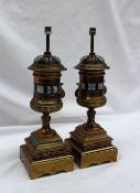 A pair of champleve enamel and gilt metal lamp bases, of twin handled urn shape,