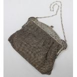A continental silver mesh purse, the double arched top inscribed to one side "Presented to.....