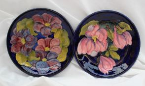 Two Moorcroft pottery plates, one decorated in the magnolia pattern, 25.