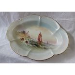 A Royal Worcester porcelain dish of oval scalloped form,