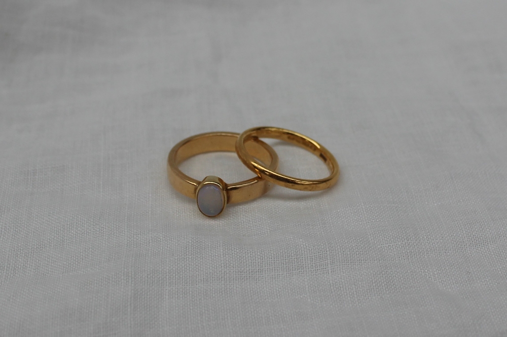 A 22ct yellow gold wedding band, approximately 3 grams,