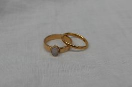 A 22ct yellow gold wedding band, approximately 3 grams,