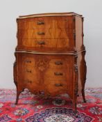 A continental burr walnut and mahogany chest on chest,