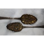A pair of late George III silver berry spoons, the lobed bowls decorated with fruit, London, 1808,