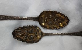 A pair of late George III silver berry spoons, the lobed bowls decorated with fruit, London, 1808,