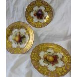 A set of three Royal Worcester porcelain cabinet plates painted with peaches and gooseberries by