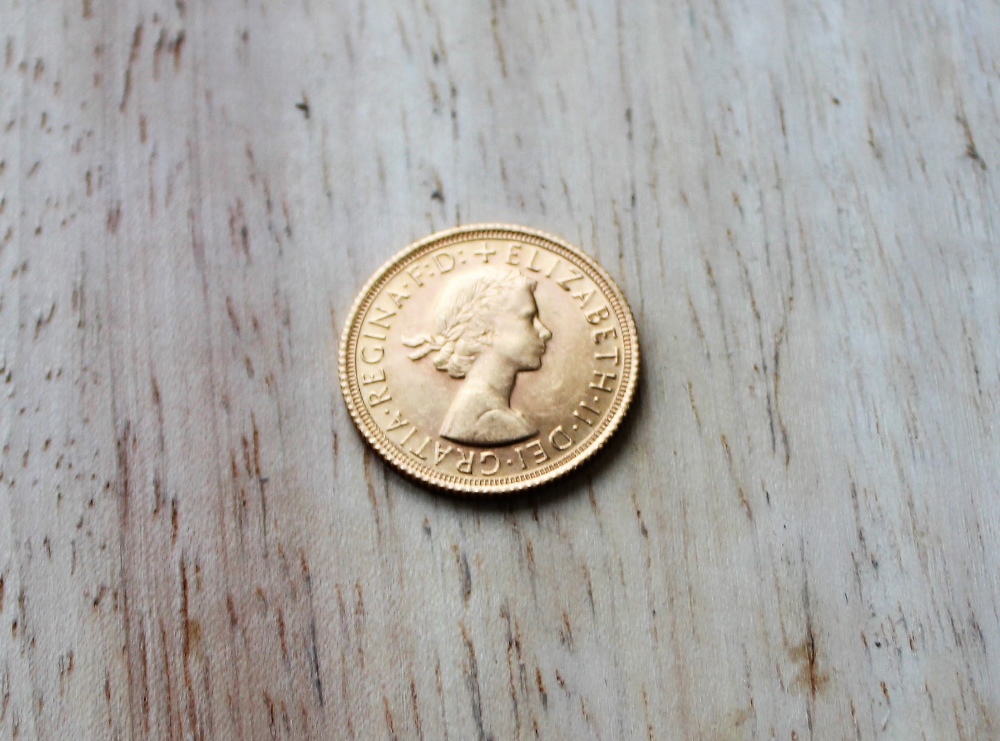 An Elizabeth II gold sovereign,