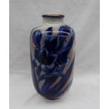 A Royal Doulton pottery vase, decorated with flower heads and leaves in blue and white,