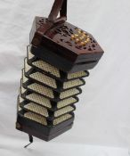 A Concertina with rosewood pierced ends, and thirty one bone buttons, No.