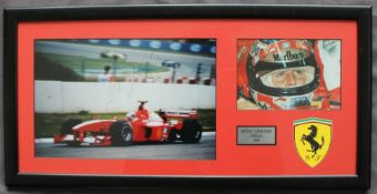Michael Schumacher a signed colour photograph with inset photograph and Ferrari symbol, 17.