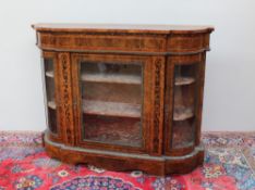 A Victorian walnut credenza, the shaped top cross banded and decorated with interlaced shamrocks,