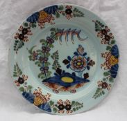 An 18th century Bristol delft polychrome decorated plate, decorated with flowers and leaves, 22.