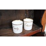 A pair of 19th century porcelain christening mugs with a gilt rim, inscribed Emily and Edward, 6.