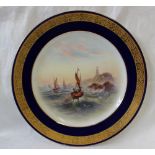 A Royal Worcester porcelain plate of circular form with a foliate gilt band in a blue border,
