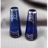 A pair of Art Nouveau style blue glass and silver overlaid vases of tapering cylindrical form,