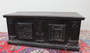 A large 19th century carved oak coffer the rectangular top with a geometric carved edge,