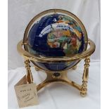 An Icyy Co Ltd gemstone globe on a gilt metal stand these handcrafted globes use over 40 different