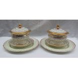 A pair of 19th century porcelain sauce tureens, covers, stands and matching plates,