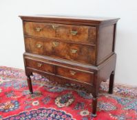 An 18th century and later oak and walnut chest on stand,
