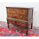 An 18th century and later oak and walnut chest on stand,