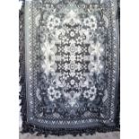 A large black and white wool bed spread,