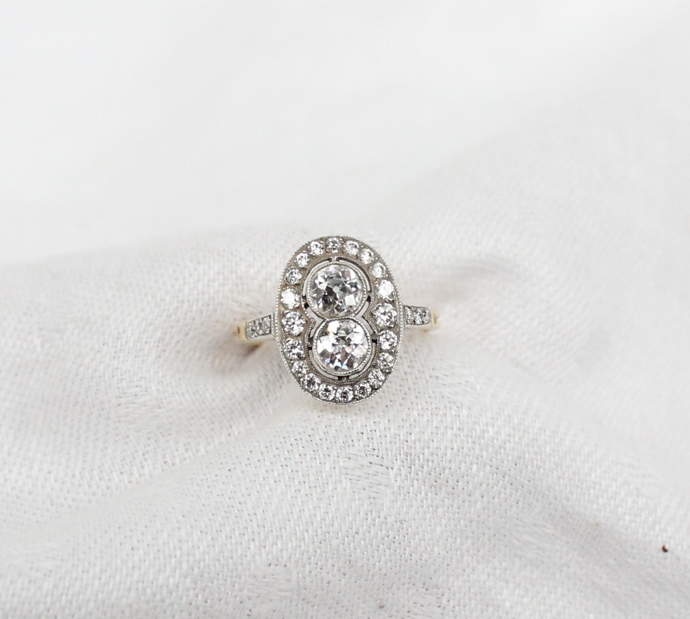 A diamond dress ring, set with two round old cut diamonds each approximately 0. - Image 2 of 6