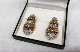 A pair of Italian 18ct yellow gold and diamond set earrings,