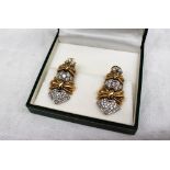 A pair of Italian 18ct yellow gold and diamond set earrings,